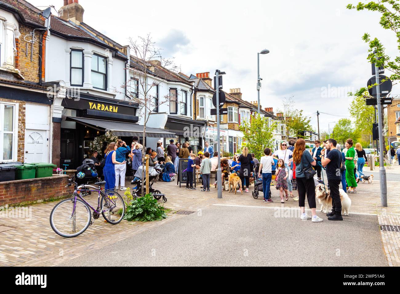 People outside Yardarm wine shop on Francis Road during Francis Road