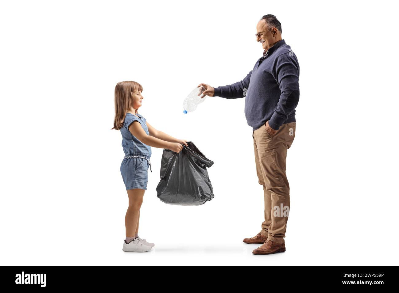 Little girl holding a plastic waste bag and man throwing a bottle isolated on white background Stock Photo