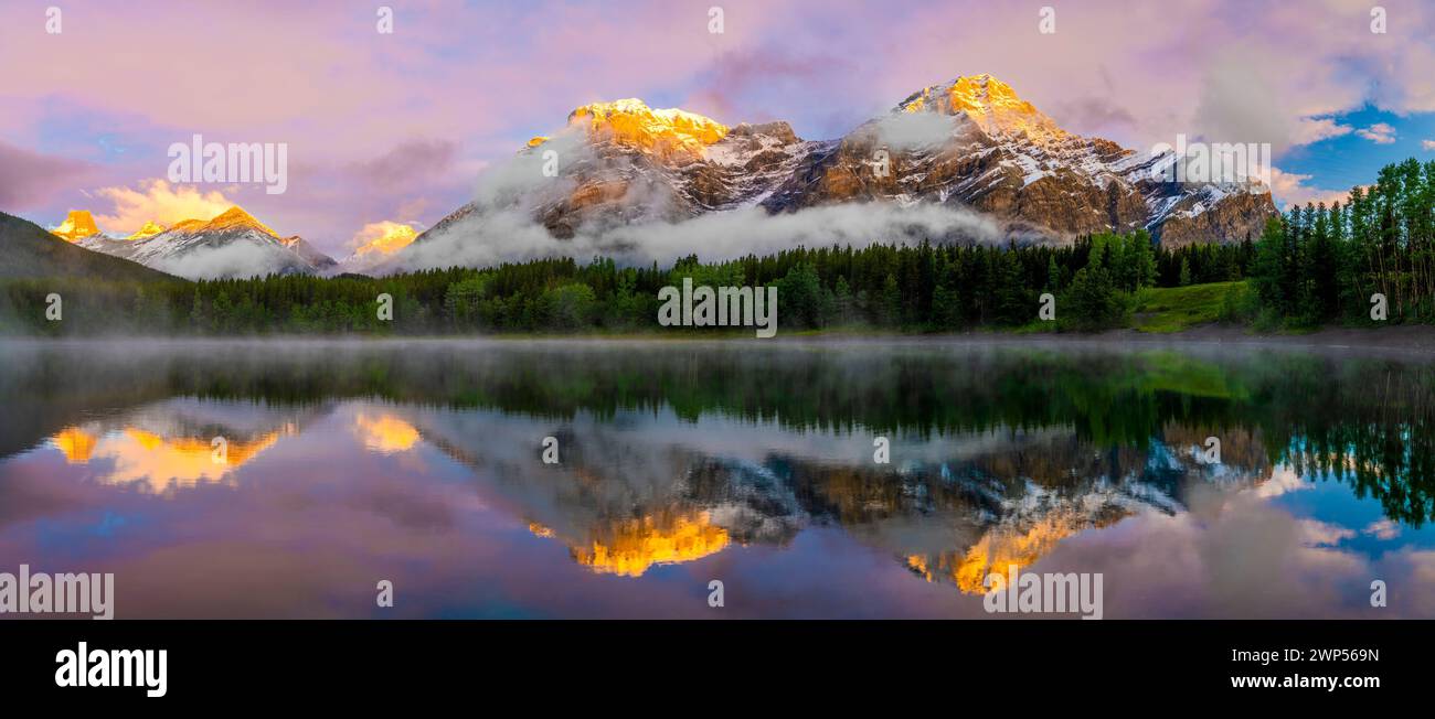 Mountain reflecting in lake, Wedge Pond, Mount Kidd, Alberta, Canada Stock Photo