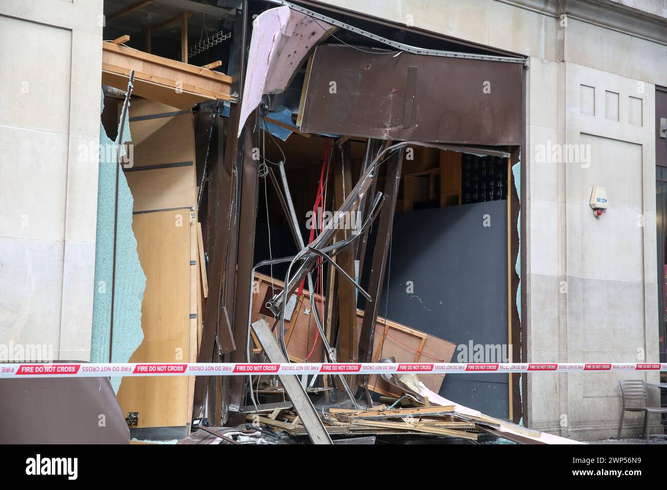 View of damages at the entrance to All One Bar on New Oxford Street