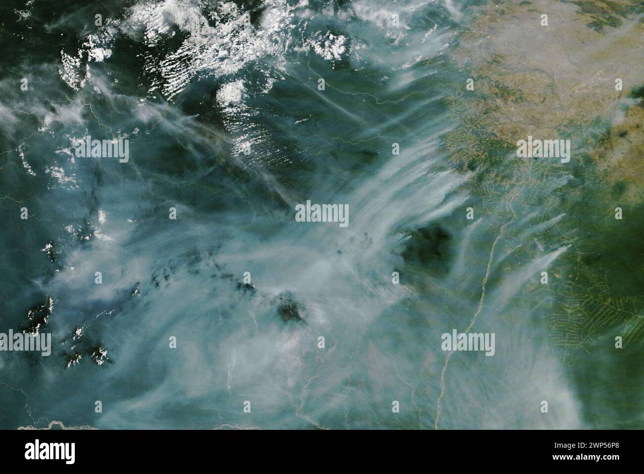 Brazil. 22nd Feb, 2024. Roraima, Brazil's northernmost state, has a wet climate, which helps rainforests thrive and suppresses the natural occurrence of forest fires, even during the dry season. Nonetheless, remote sensing scientists have observed fires in this northern Amazon region for as long as satellite observations have been available, especially during the drier months of October through March. Most are management fires, ignited for purposes such as burning pastures and agricultural areas or clearing rainforest. In the second half of February 2024, NASA satellites observed unusuall Stock Photo