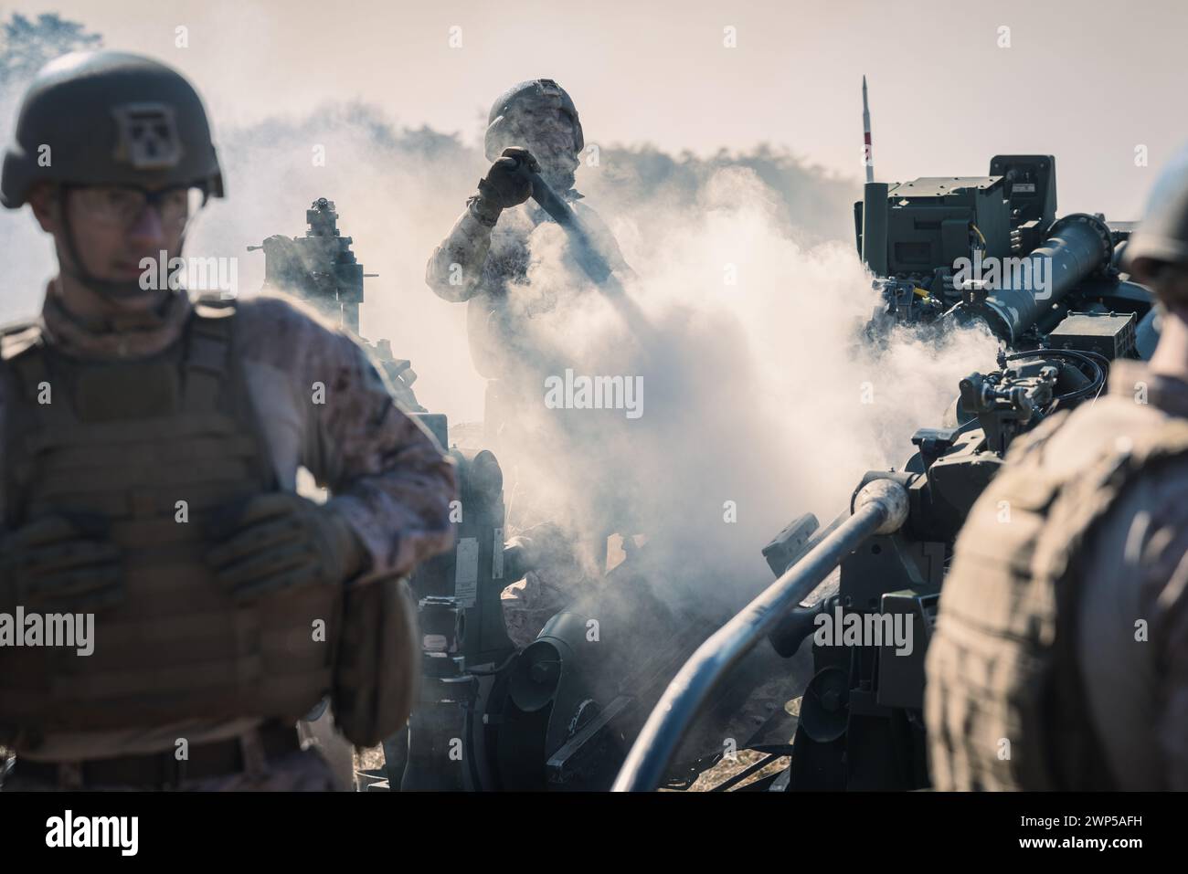 U.S. Marines with The Basic School demonstrate how to operate an M777 ...