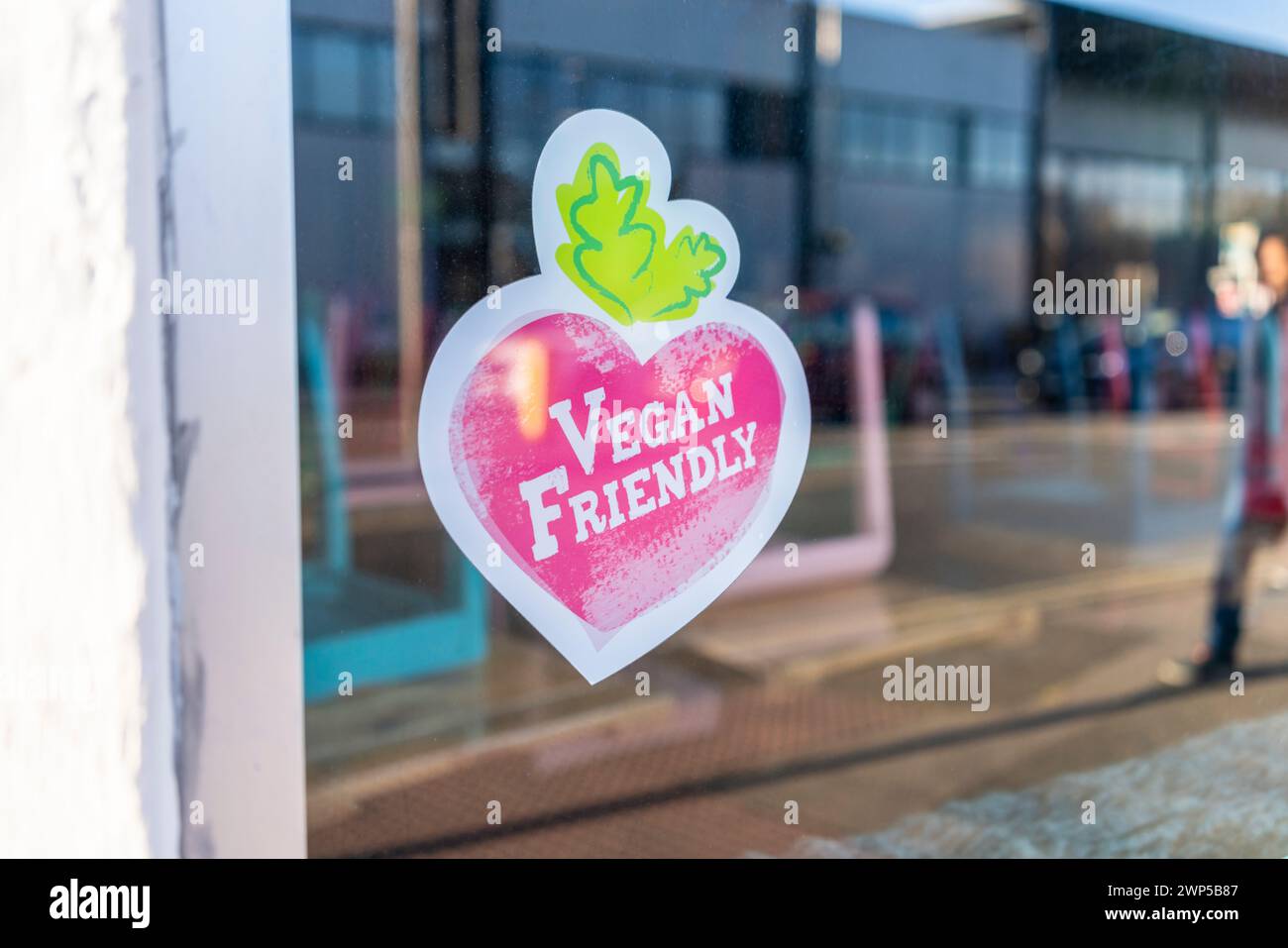 Vegan friendly sticker on a window in the shape of a heart vegetable - vegan friendly concept - Southampton, England, UK Stock Photo