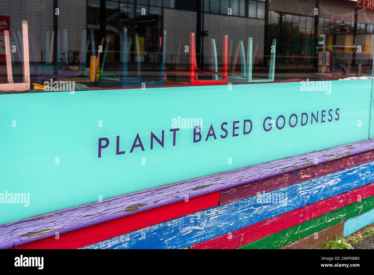 Plant based goodness signage in a window of a vegan food restaurant in Southampton, England, UK Stock Photo
