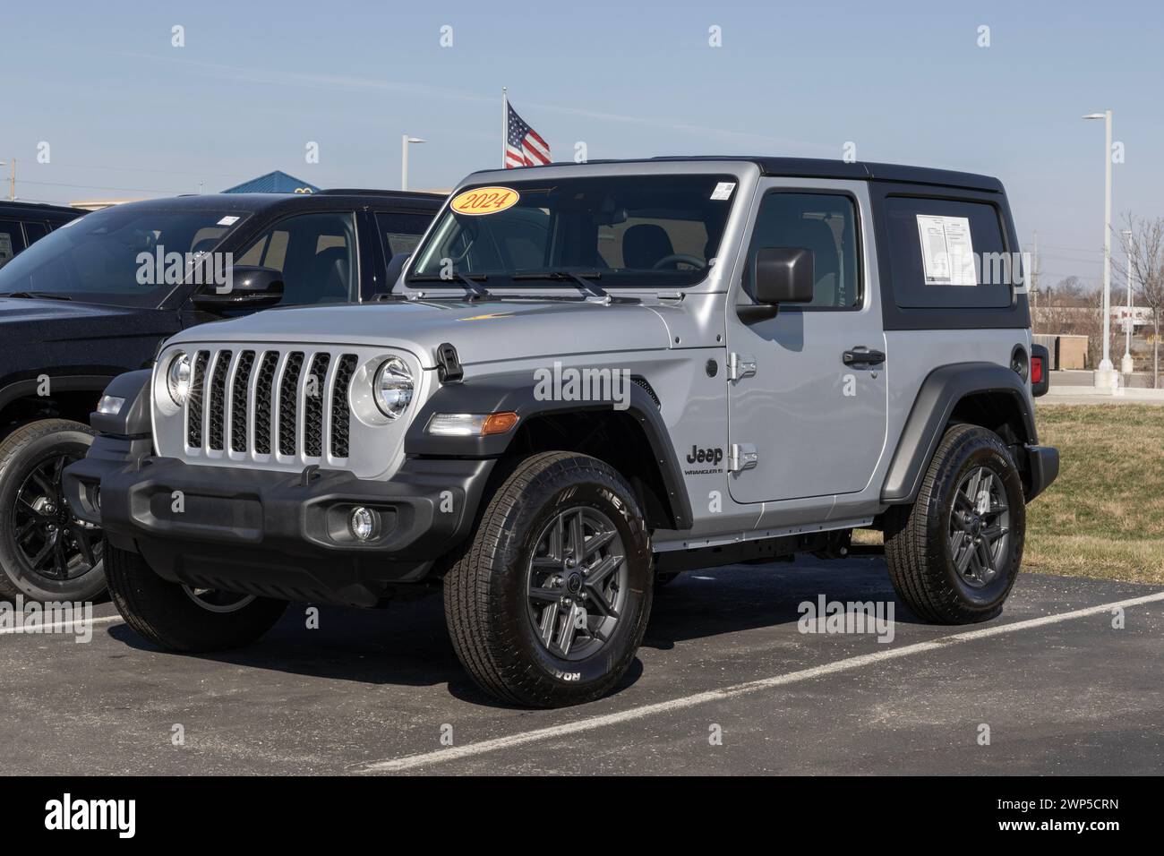 Noblesville - February 3, 2024: Used Jeep Wrangler display at a dealership. With supply issues, Jeep is selling many pre-owned cars to meet demand. MY Stock Photo