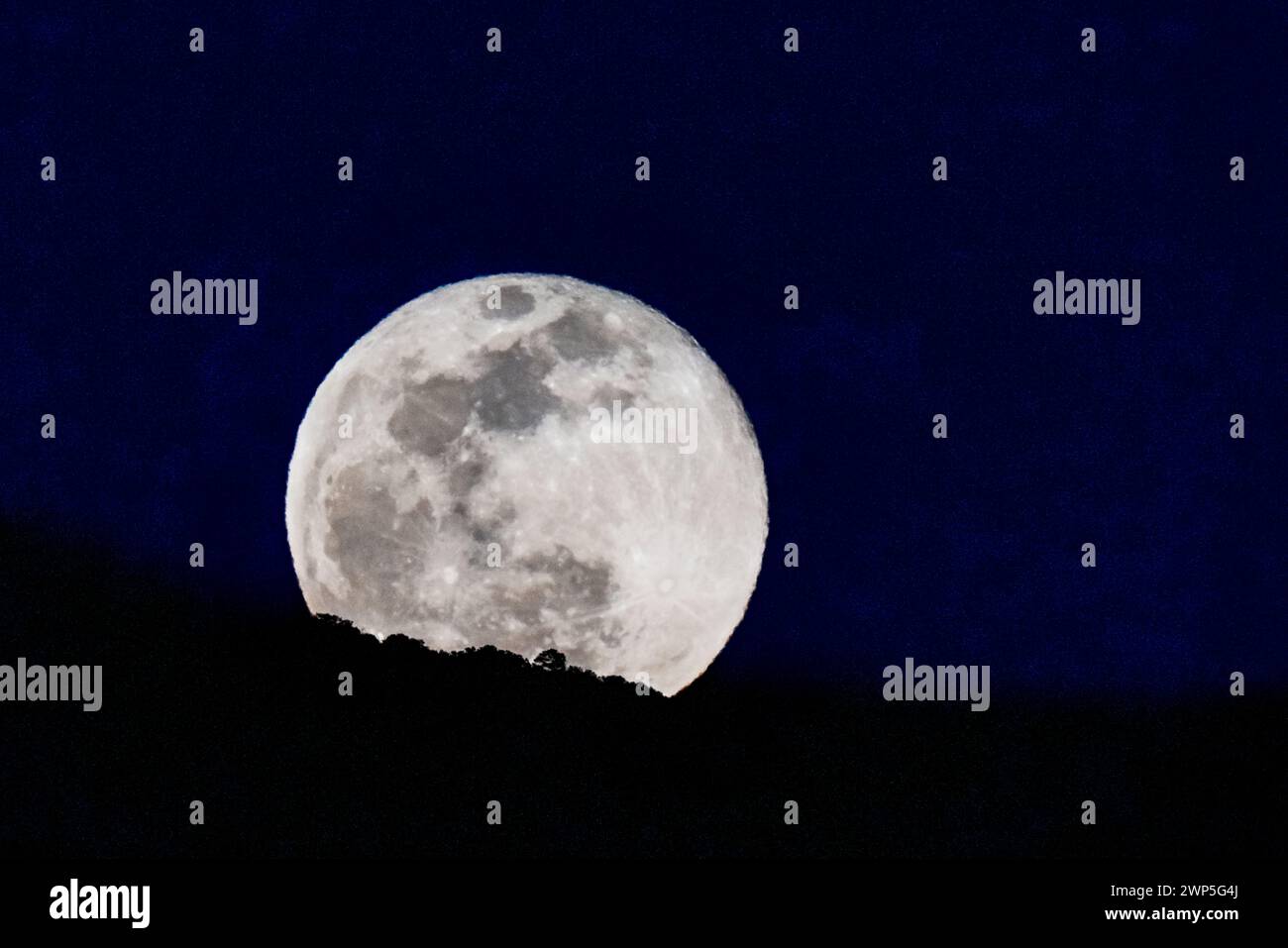 Full Snow Moon; Wolf Moon; Micro Moon; rising over Rocky Mountains ...