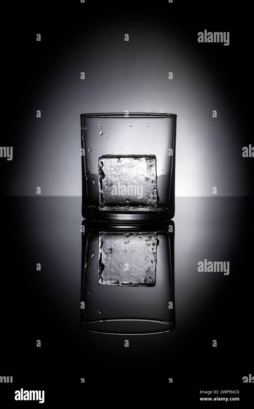 one the rocks ice on reflective balck background Stock Photo - Alamy