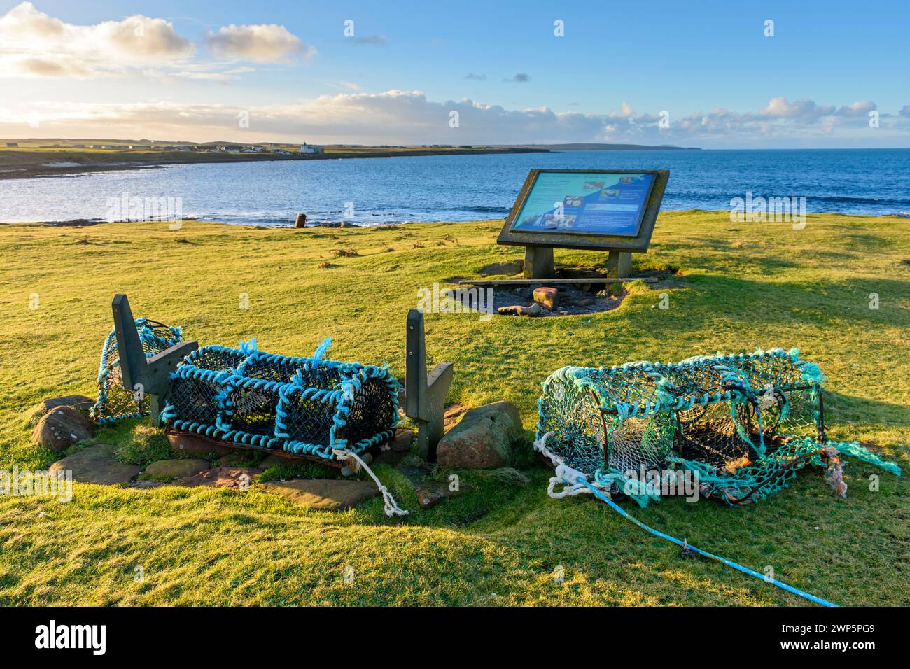Lobster or crab creels and information sign at the Ness of Duncansby, between John o'Groats and Duncansby Head, Caithness, Scotland, UK Stock Photo