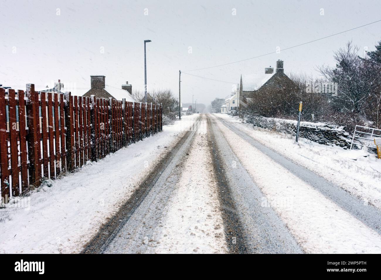 The main Thurso to John o'Groats road, the A836, during a snowstorm.  At the village of Mey, Caithness, Scotland, UK Stock Photo