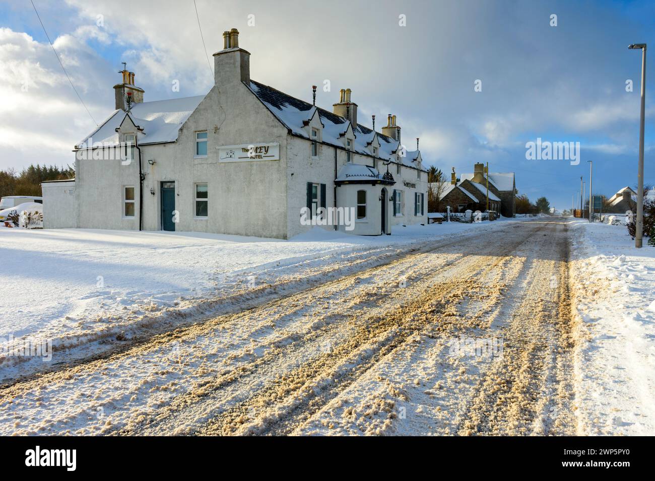 The Mey Hotel on the A836 trunk road after a heavy snowfall, at the village of Mey, Caithness, Scotland, UK Stock Photo