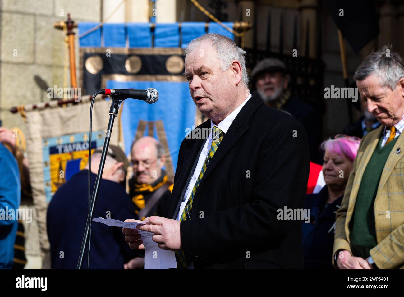 Truro, UK. 5th March 2024. Nev Meek speaks to St Piran's Day crowds as President of the Federation of Old Cornwall Societies. Credit: Kai Greet/Alamy Live News. Stock Photo