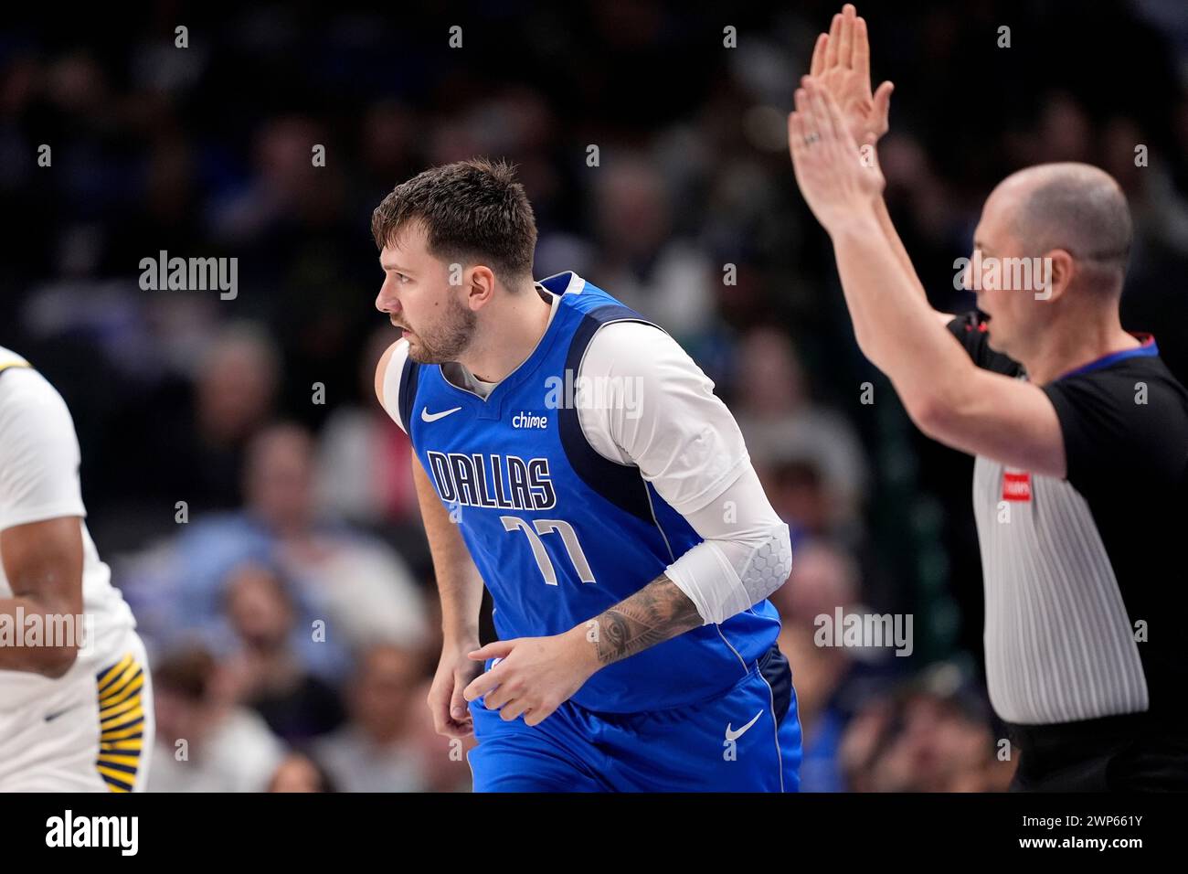 Dallas Mavericks' Luka Doncic (77) runs upcourt after sinking a 3-point ...