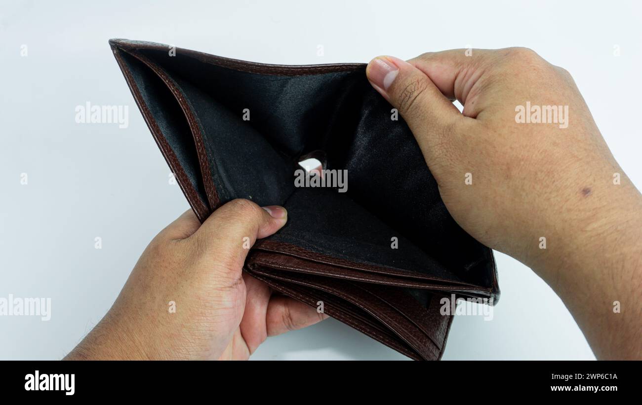 Empty wallet opened by hand isolated on white background Stock Photo
