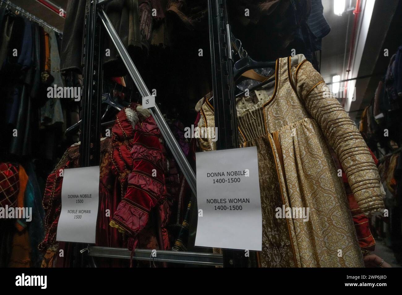 Dresses hang at the Tirelli's warehouse in Formello near Rome, Tuesday