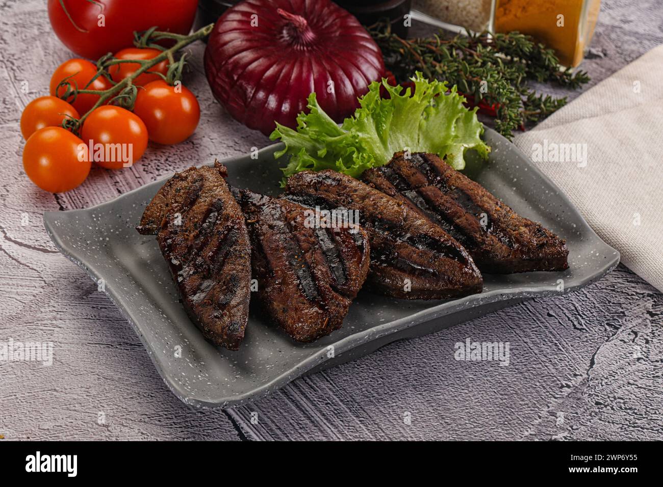 Grilled diet beef liver steak in the plate Stock Photo - Alamy