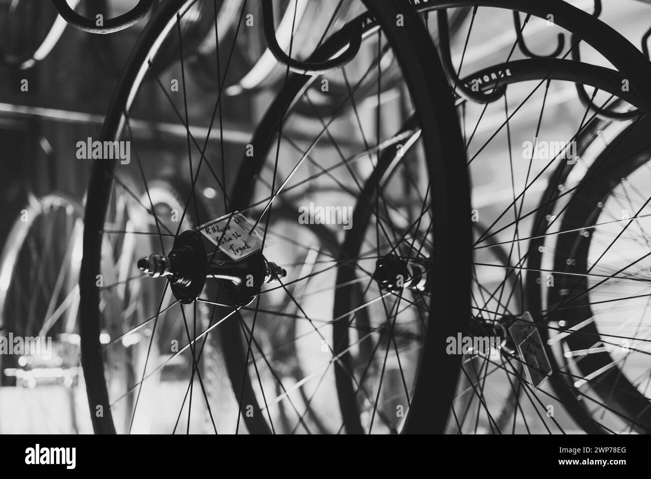 bicycle wheel rims hanging on hangers Stock Photo