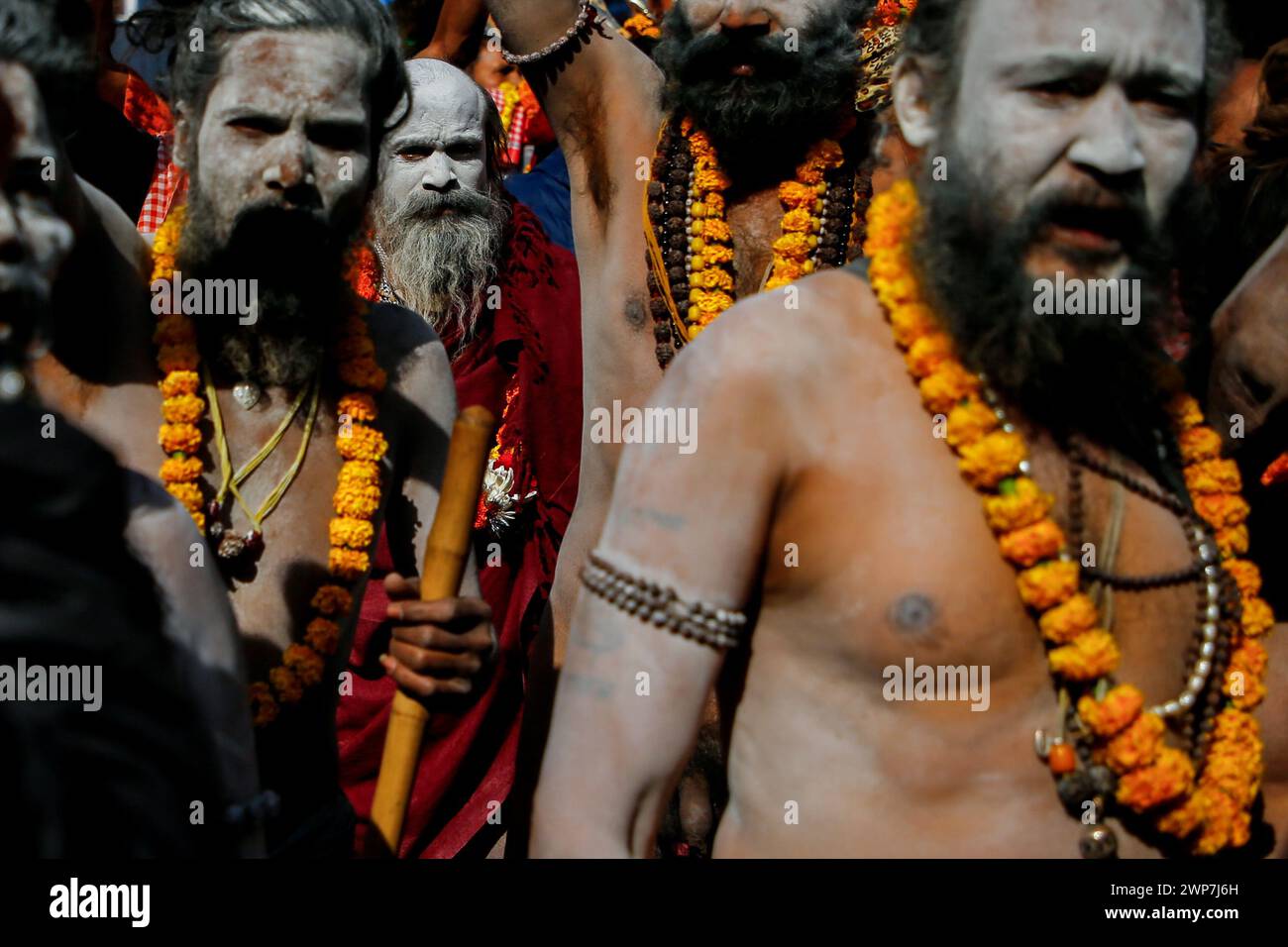 Kathmandu, Nepal. 06th Mar, 2024. Sadhus, holy men known as the followers of Lord Shiva take part in a religious rally for the upcoming Maha Shivaratri festival inside Pashupatinath Temple. Thousands of sadhus from India and Nepal come to celebrate the festival of Maha Shivaratri by smoking marijuana, smearing their bodies with ash, and offering prayers devoted to the Hindu Deity Lord Shiva. Credit: SOPA Images Limited/Alamy Live News Stock Photo