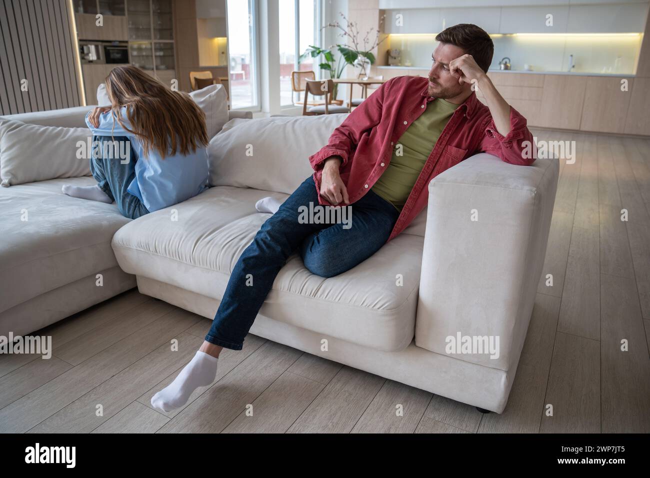 Depressed sulking man sitting hi-res stock photography and images - Alamy