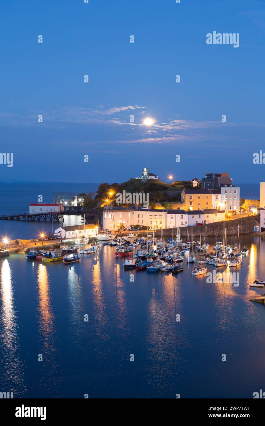 UK, Tenby, The harbour on a moon lit night. Stock Photo