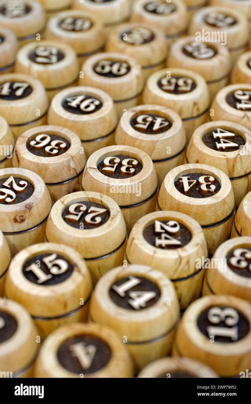 Big group of wooden lotto barrels with numbers, abstract random numbers background Stock Photo