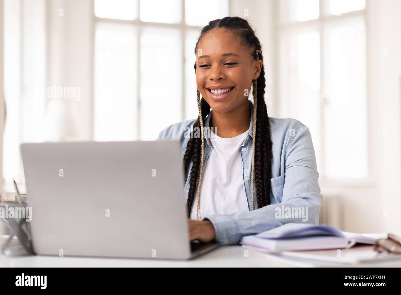 Female university student at desk home hi-res stock photography and ...