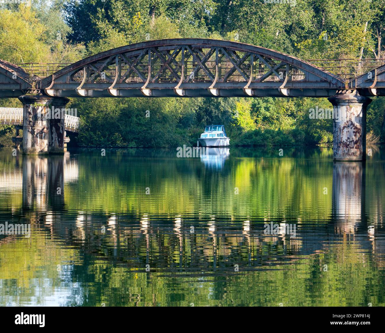 A very scenic part of the River Thames as it joins Hinksey Stream at Kennington. . The scene is dominated by an abandoned railway bridge, unused for m Stock Photo