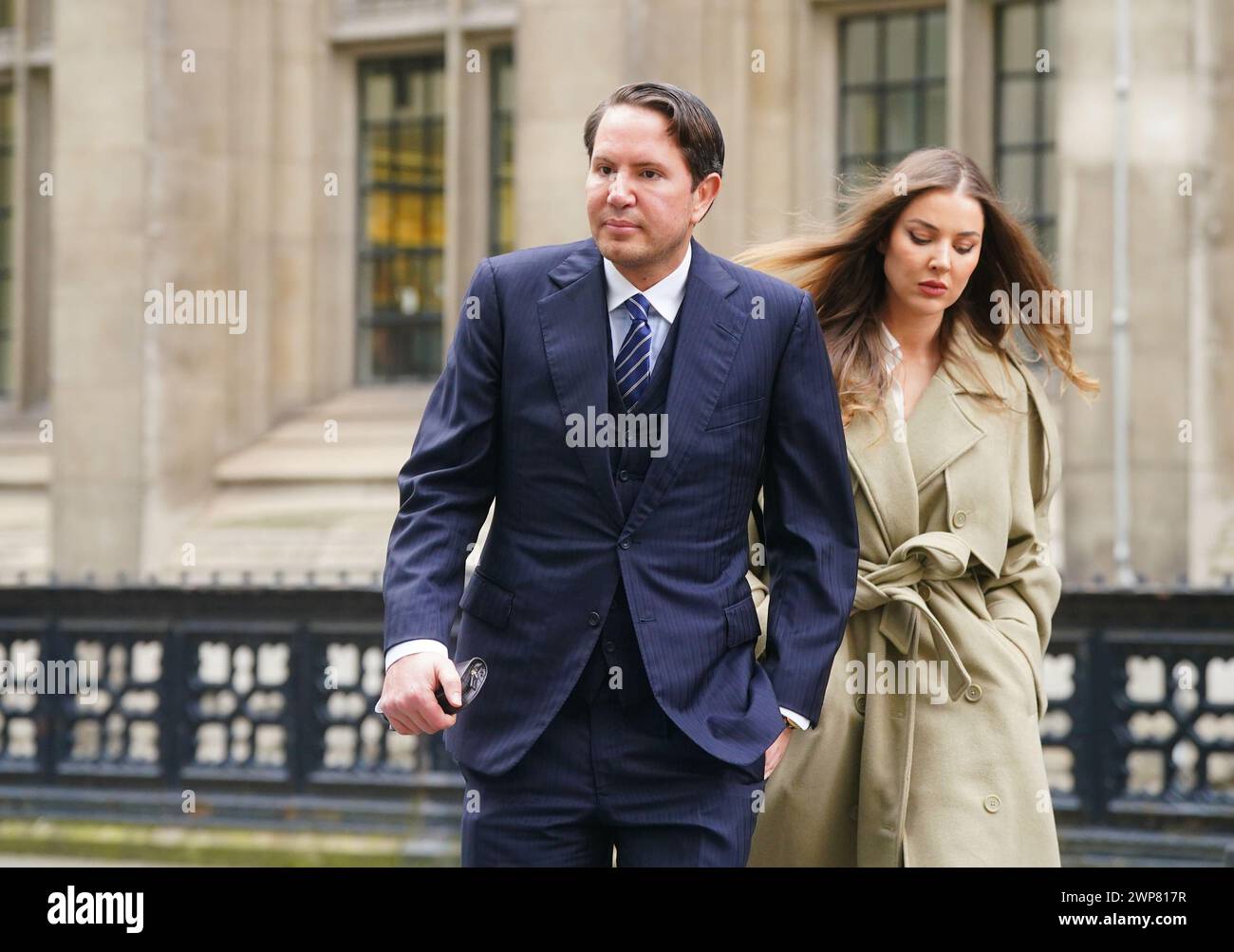 James Stunt arrives with Helena Robinson, at the Rolls Building, in London, where he is due in the witness box as his bankruptcy trial continues. The British socialite, art dealer and former son-in-law of ex-Formula 1 boss Bernie Ecclestone is in a High Court dispute over whether he is the owner of a centuries-old painting. Picture date: Wednesday March 6, 2024. Stock Photo