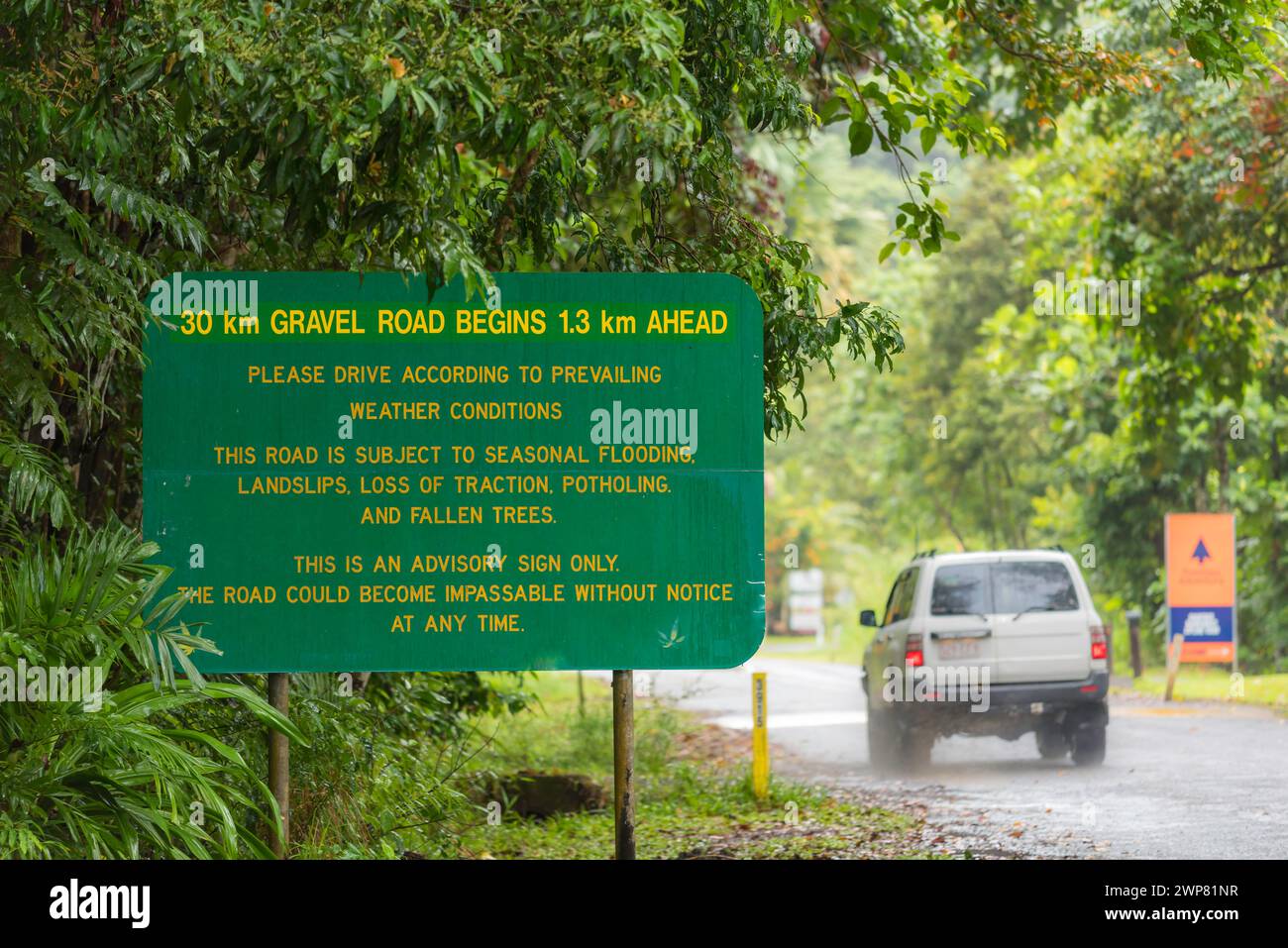A 4WD passes warning sign at the northern tip of Cape Tribulation in North Queensland, Australia where the road becomes suitable for 4WD vehicles only Stock Photo