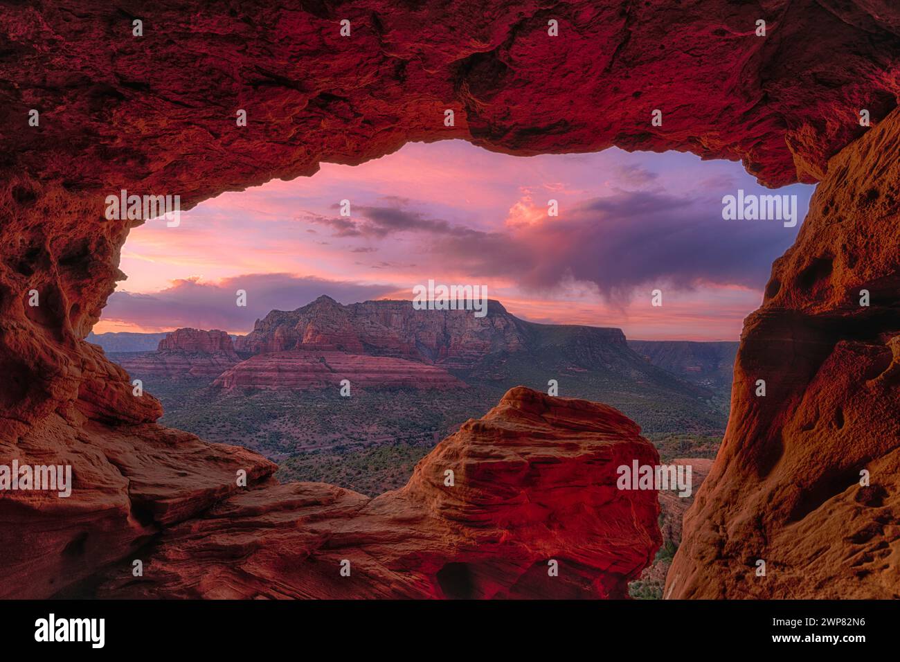 The Sun setting over red rock canyons in Sedona, Arizona Stock Photo ...