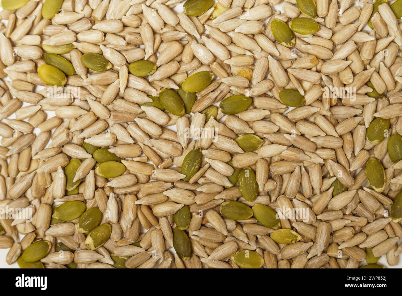 Mixed seeds pile isolated sunflower hi-res stock photography and images ...