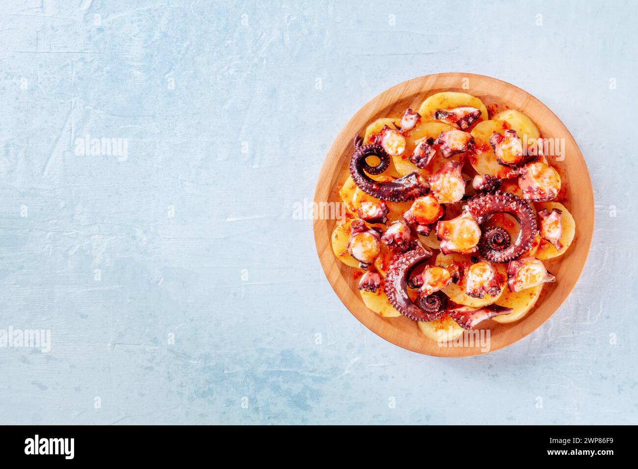 Pulpo a la gallega, Spanish octopus and potato dinner, Galician dish, shot from the top with copy space Stock Photo