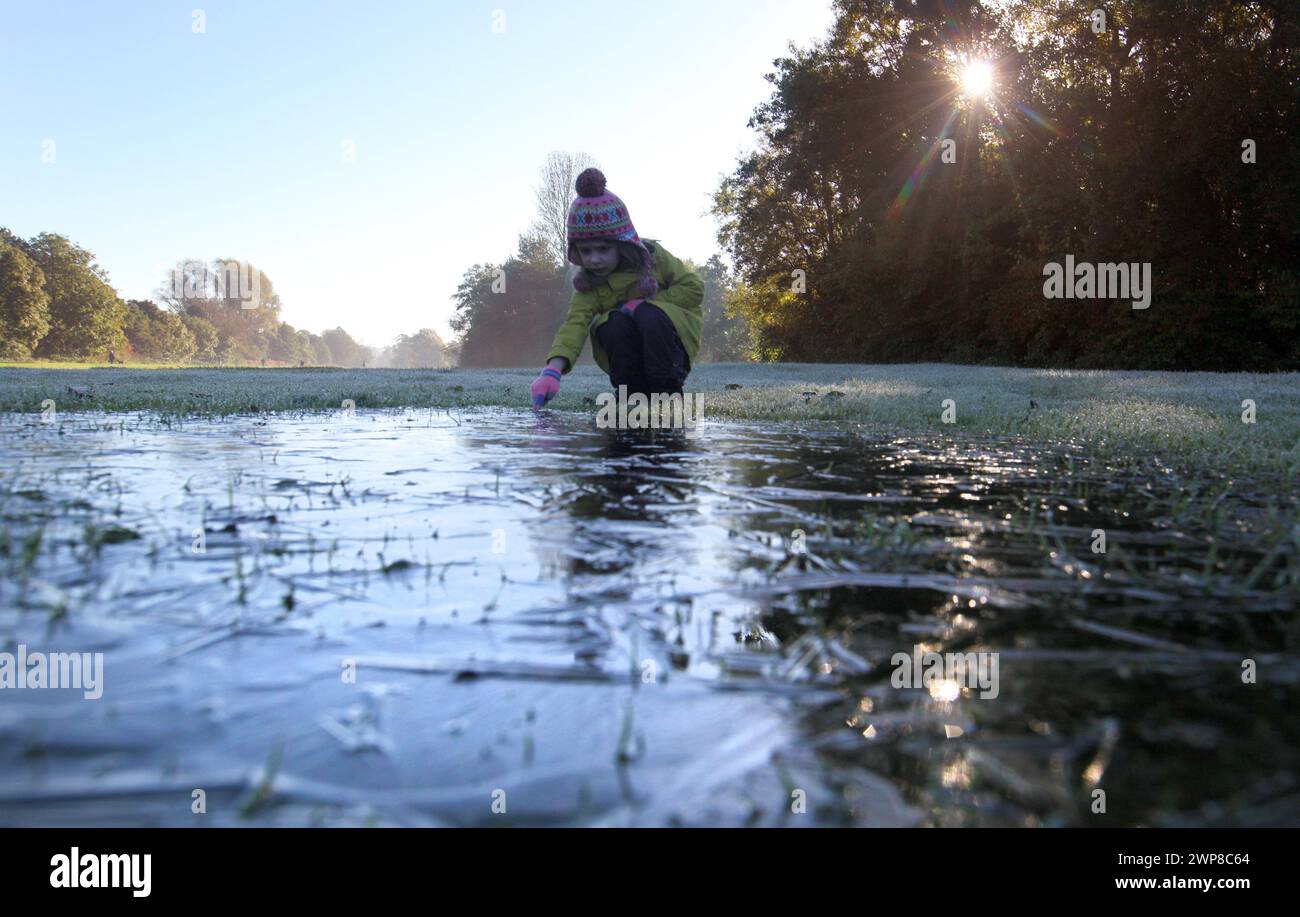14/10/12 Freya Kirkpatrick, (5), plays by a frozen puddle on the first ...