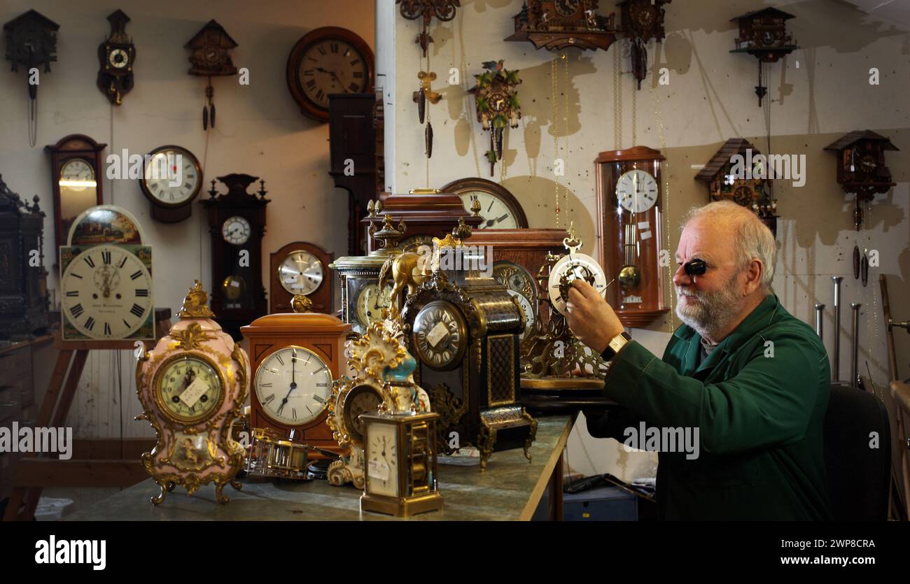 25/10/12    Clockmaker, Peter Cox, works against the clock to repair customers' clocks ahead of this weekend's return to Greenwich Mean Time. Peter (6 Stock Photo