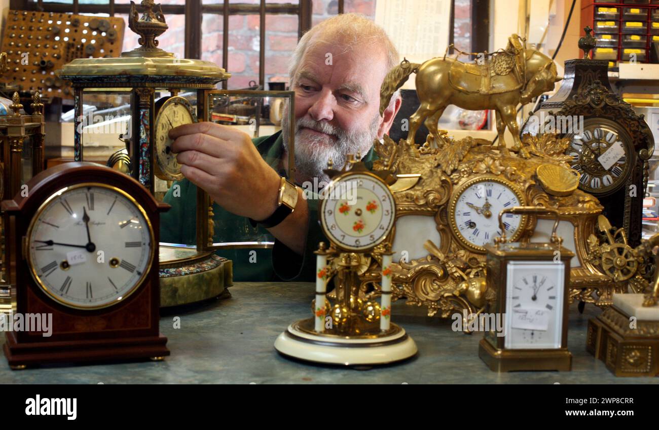 25/10/12    Clockmaker, Peter Cox, works against the clock to repair customers' clocks ahead of this weekend's return to Greenwich Mean Time. Peter (6 Stock Photo