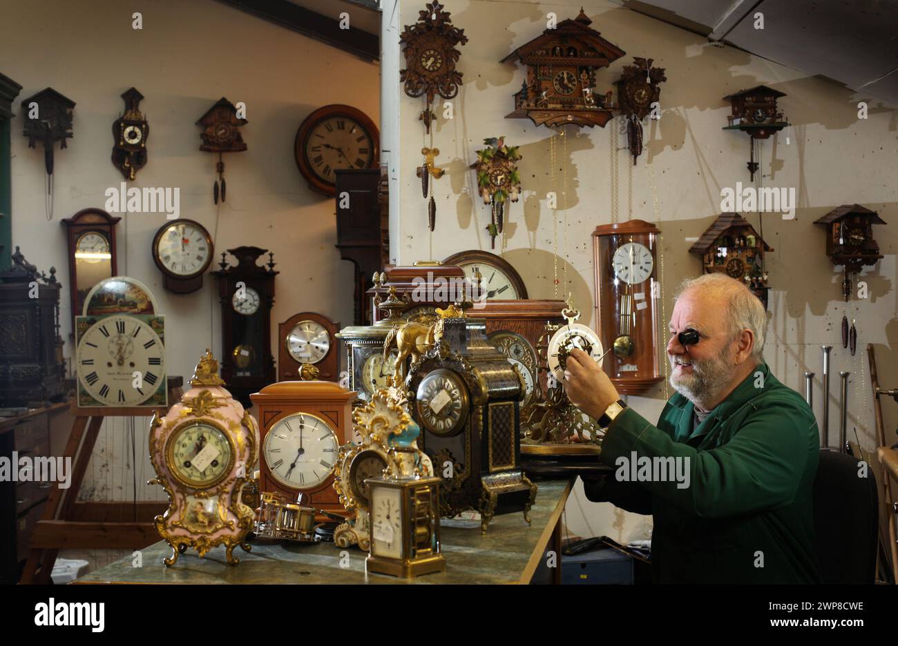 25/10/12    Clockmaker, Peter Cox, works against the clock to repair customers' clocks ahead of this weekend's return to Greenwich Mean Time. Peter (6 Stock Photo