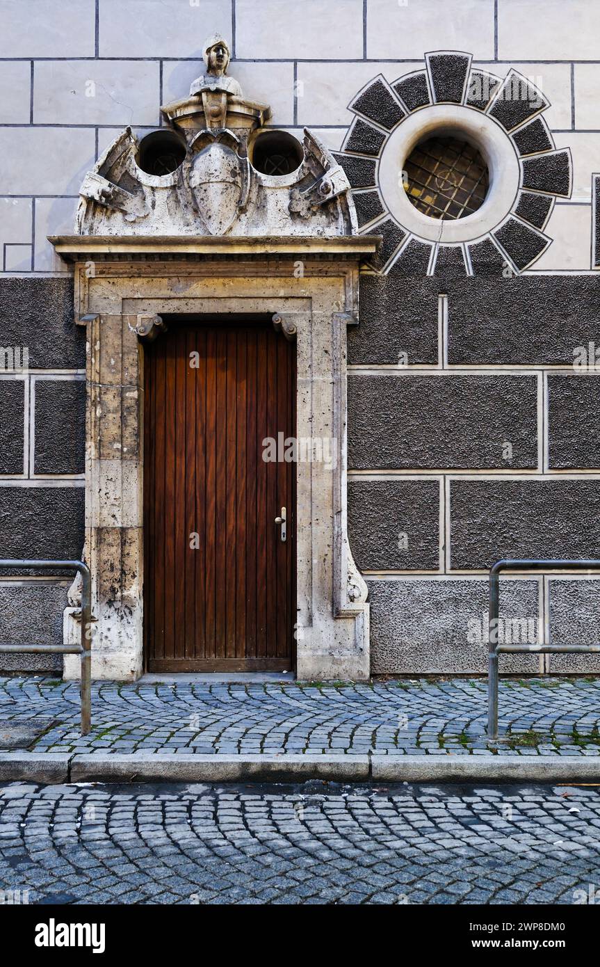 An Ornate entrance and round window of a building in Ulm an der Donau in Southern Germany Stock Photo