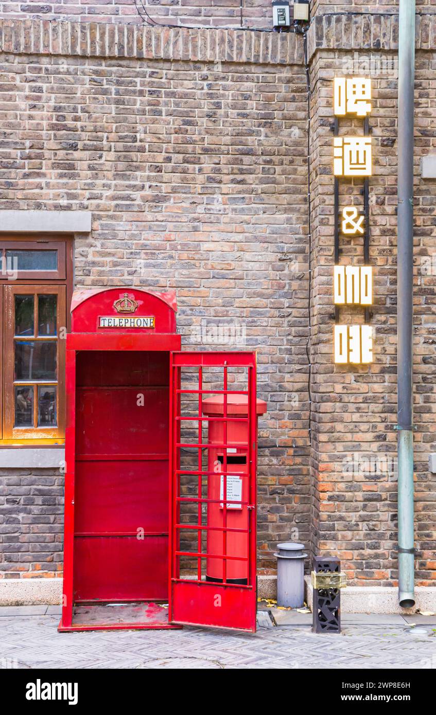 Traditional red English phone booth in the Five Great Avenues of Tianjin, China Stock Photo