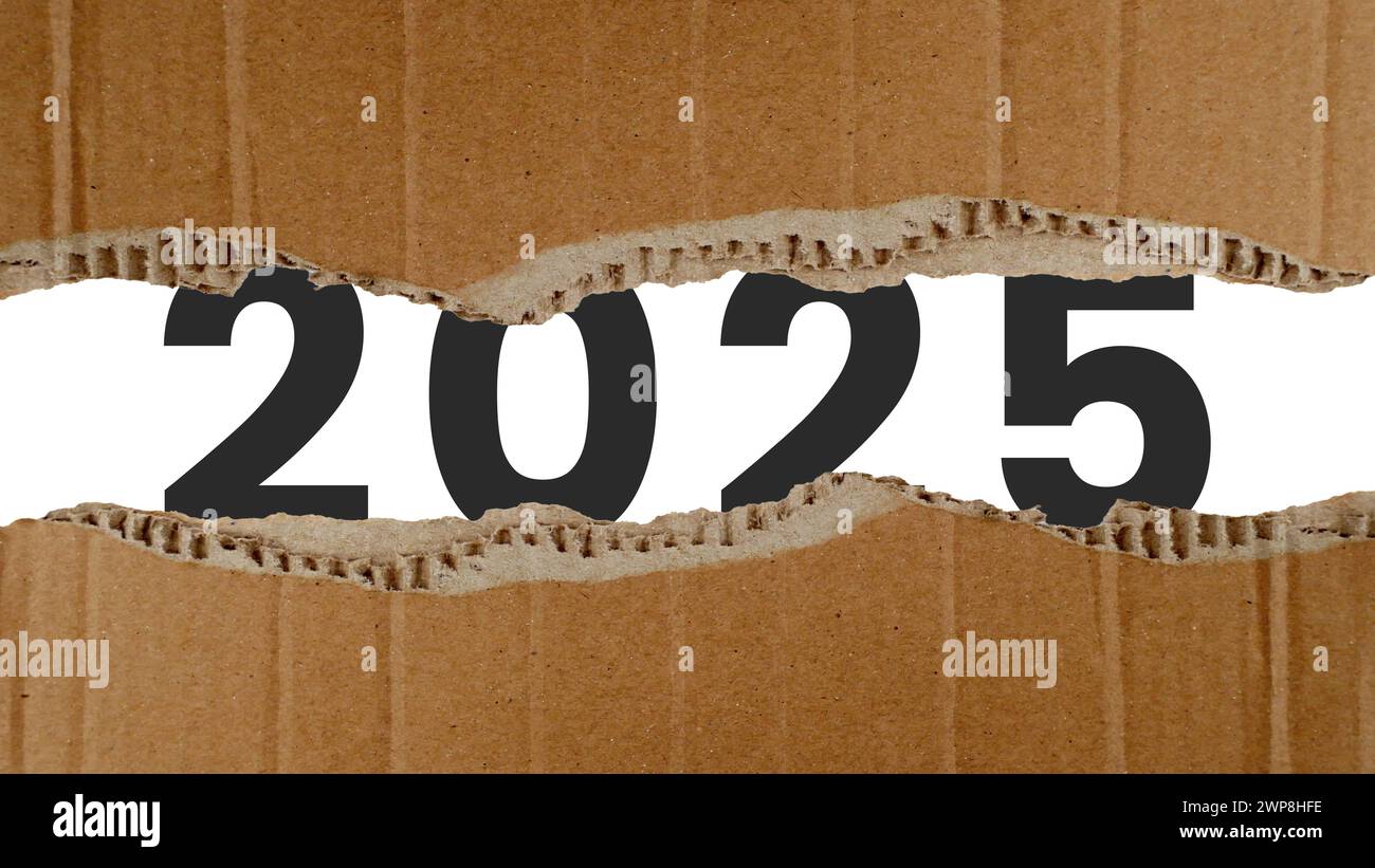 Concept of 2025 new year behind torn cardboard. Happy New Year 2025