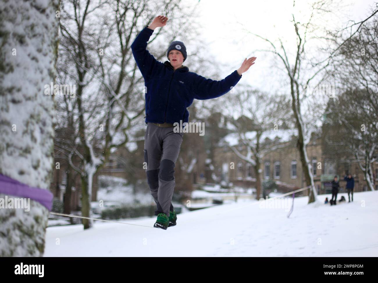 05/02/13   Matt Stevens, 19, practises slacklining across a line strung between trees in Buxton, Derbyshire during heavy snowfall. 'The snow gives a s Stock Photo