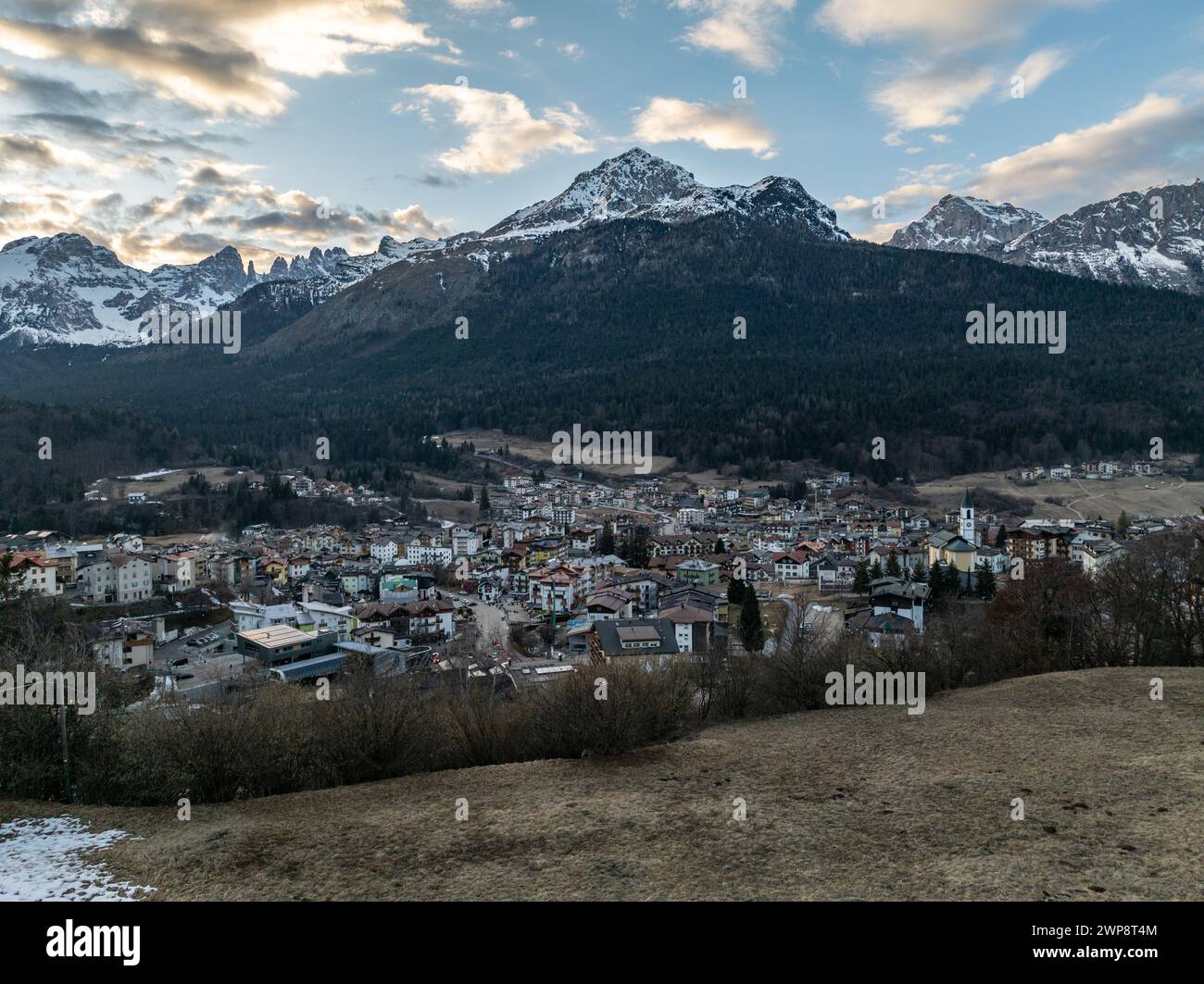 Aerial drone view of Andalo town with mountains background in winter. Ski resort Paganella Andalo, Trentino-Alto Adige, Italy., Italian Dolomites,.Pag Stock Photo