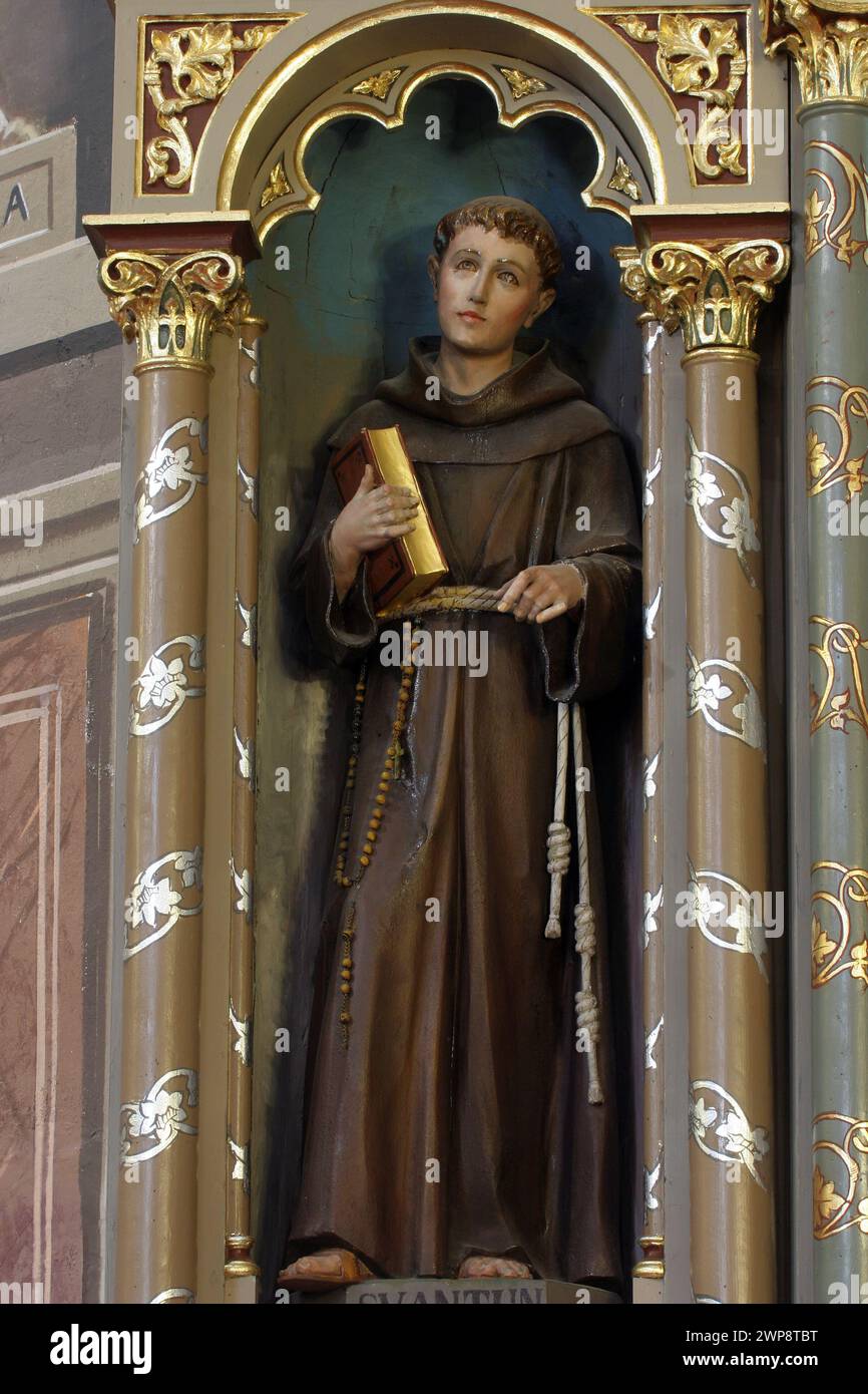 Saint Anthony of Padua, statue on the altar of Saint Florian in the church of the Saint Peter in Ivanic Grad, Croatia Stock Photo