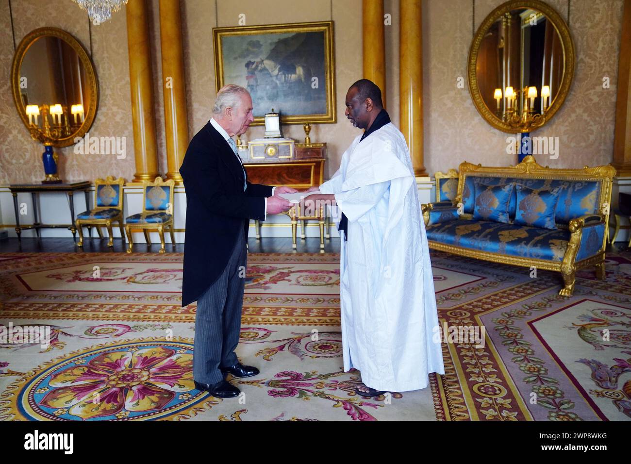 The Ambassador of Mauritania, Samba Mamadou, presents his credentials to King Charles III during a private audience at Buckingham Palace, London. Picture date: Wednesday March 6, 2024. Stock Photo
