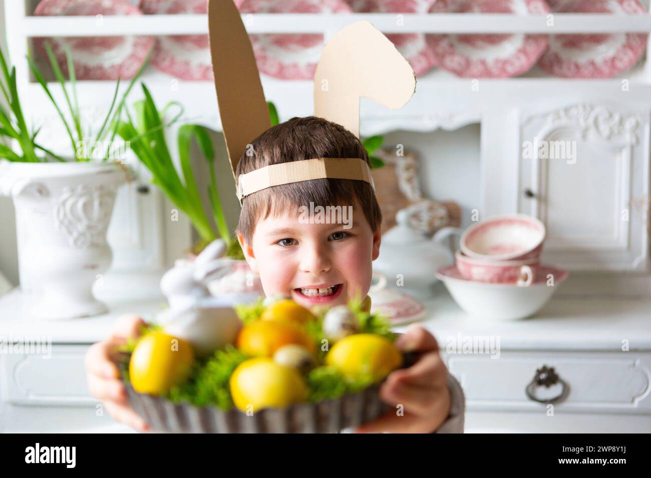 3 March 2024 Little boy holding a homemade Easter nest