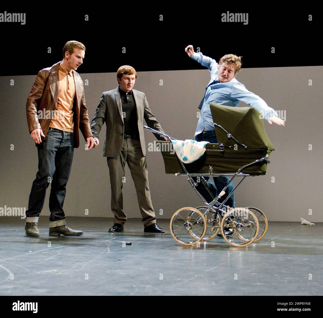 the baby stoning scene - l-r: Calum Callaghan (Fred), Billy Seymour (Colin), Bradley Gardner (Barry) in SAVED by Edward Bond at the Lyric Hammersmith Theatre, London W6  13/10/2011  design: Paul Wills  lighting: Oliver Fenwick  director: Sean Holmes Stock Photo