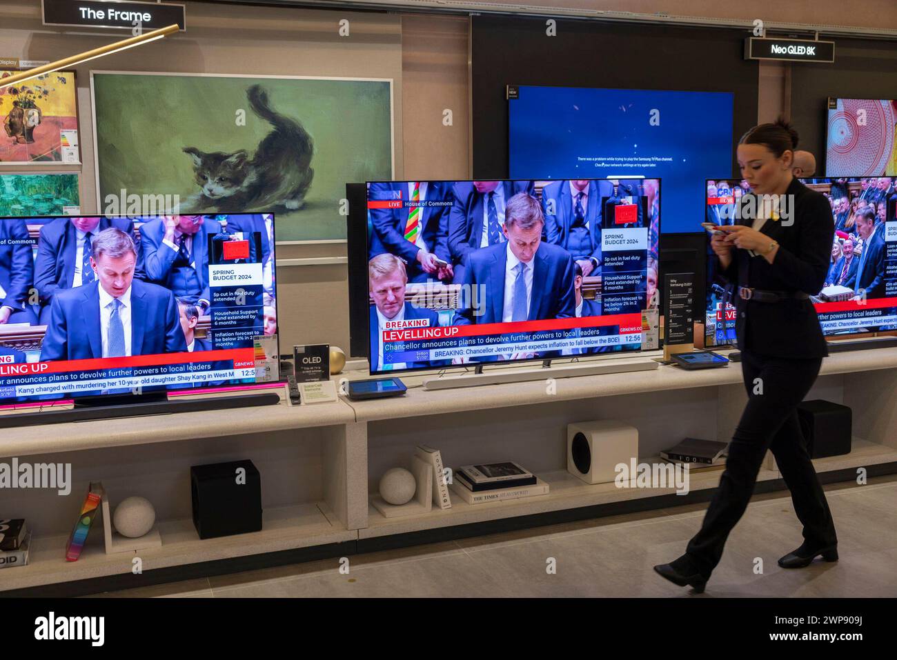 Jeremy Hunt, UK Chancellor of the Exchequer, delivers his Budget, outlining the government's tax and spending plans watched on tv screens live in a London department store. 06th March 2024. London, England, United Kingdom Stock Photo