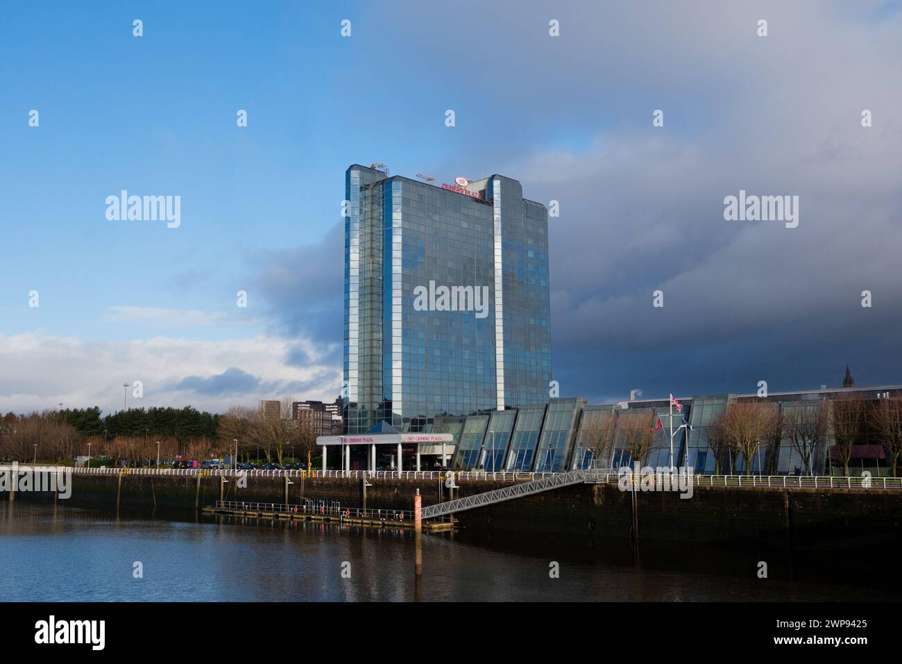 Glasgow Scotland: 13th Feb 2024: Crowne Plaza tower exterior on River Clyde near Pacific Quay dramatic clouds Stock Photo