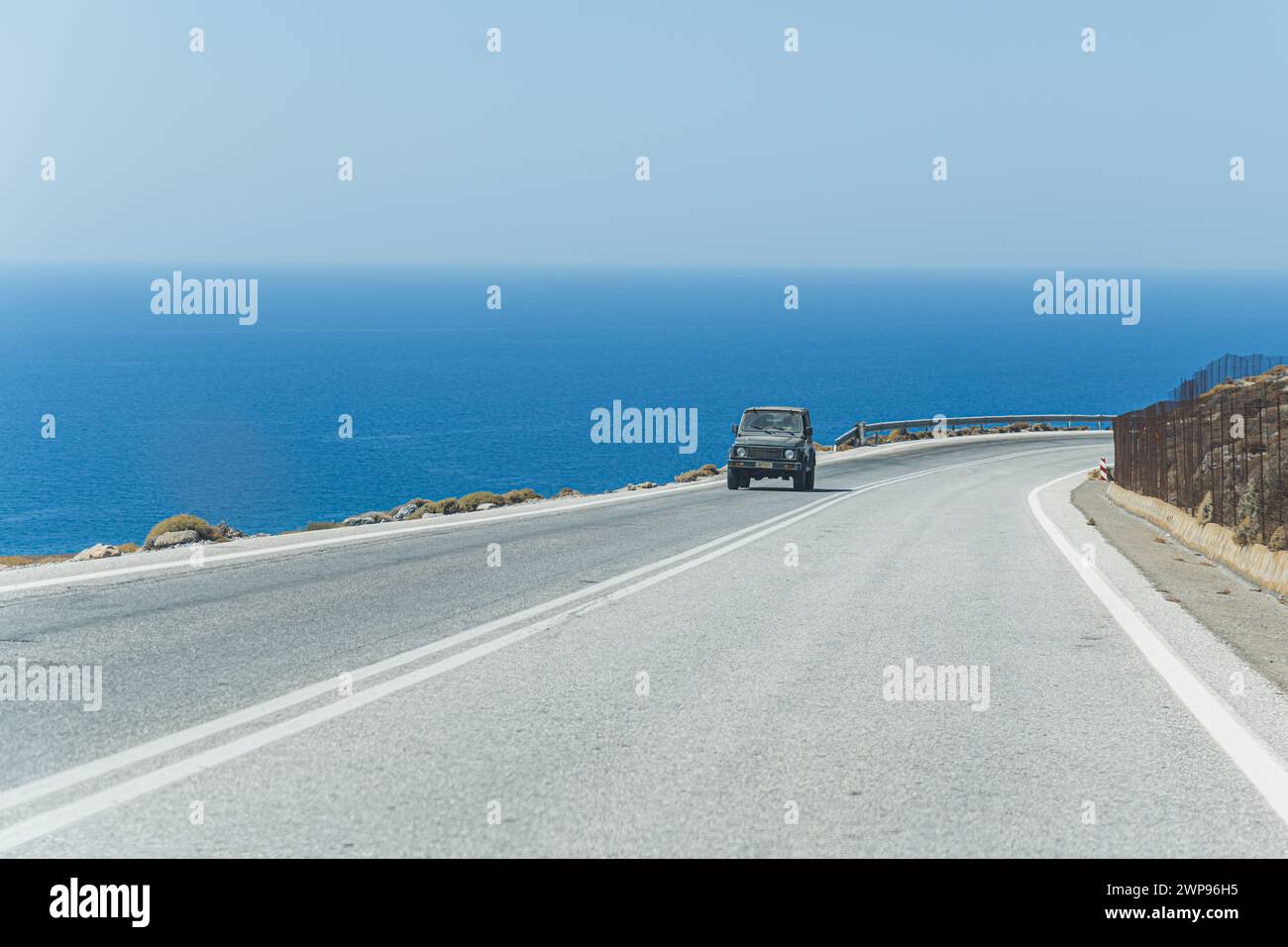 20.08.2023. Crete, Greece. driving on the road to Crete south coast, gorgeous blue water in the background. High quality photo Stock Photo