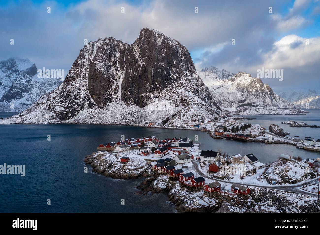 Aerial view of the Hamnøya island and the Lilandstinden mountain in Reine Bay during winter. Lofoten Islands, Norway. Stock Photo