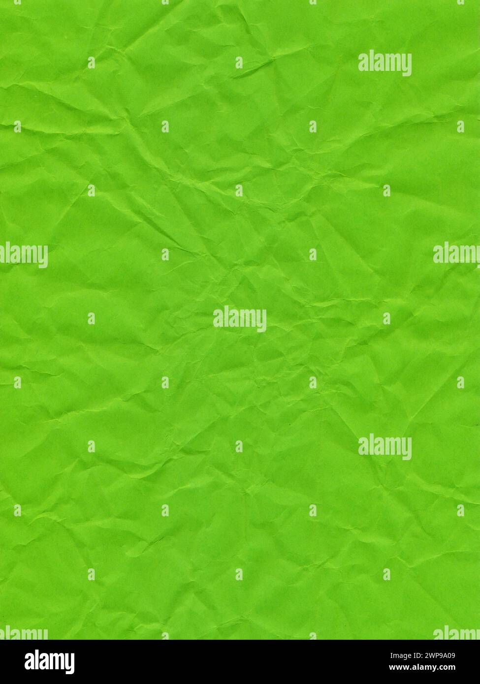 Texture of colored paper, surface of a crumpled light green sheet of paper Stock Photo