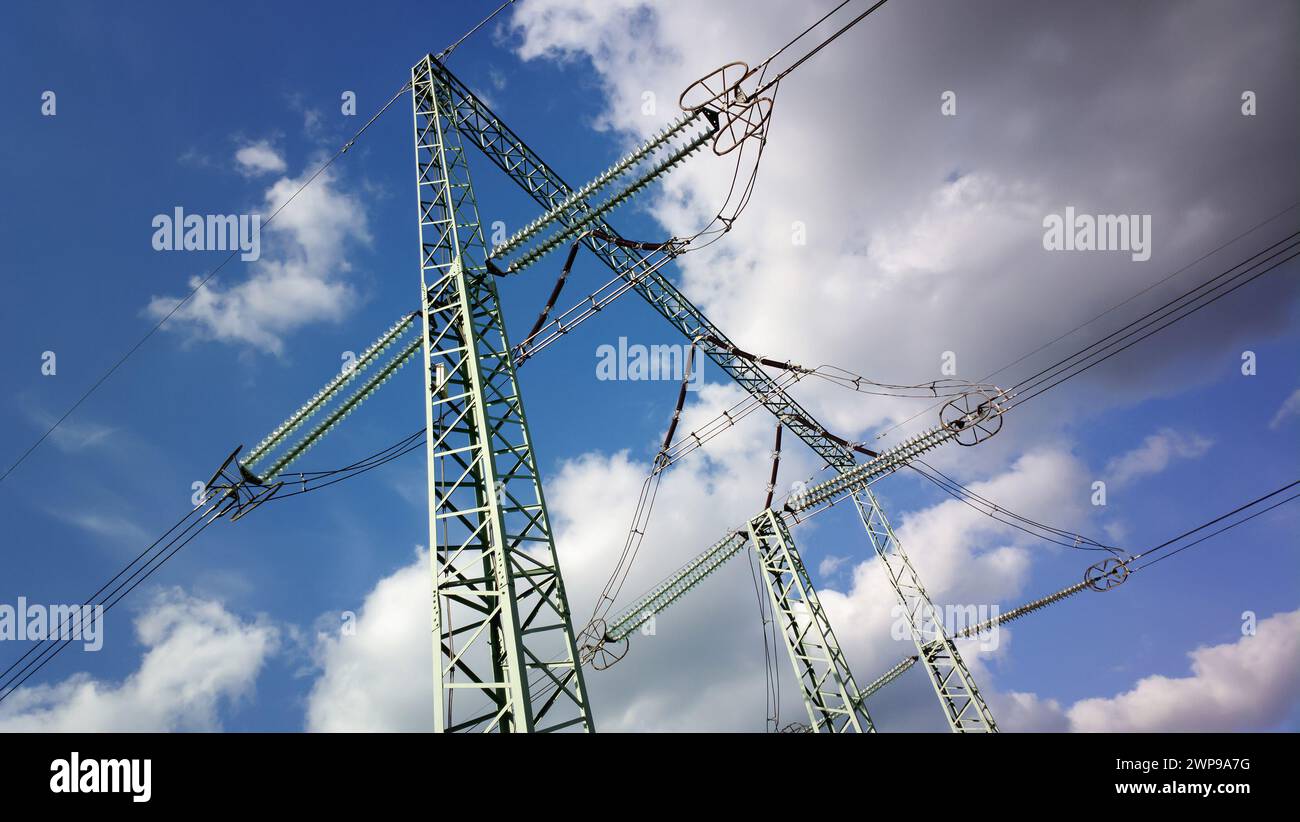Electrical poles with blue summer sky and clouds Stock Photo - Alamy